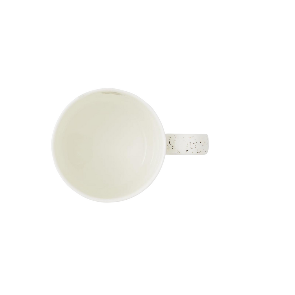 White ceramic mug with speckled handle on a white background view from above