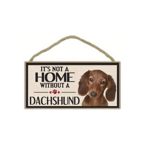 Decorative sign with a dachshund and text 'It's not a home without a dachshund' on a white background.